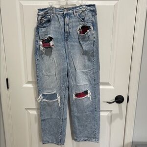 American Eagle Outfitters Distressed Blue Jeans with Red Accents
